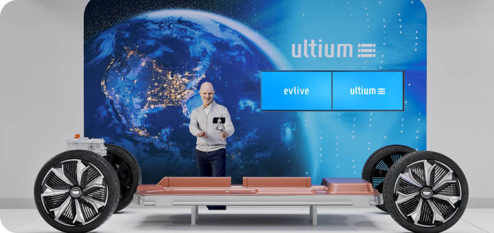 EV Live Product Specialist holding a selfie stick in studio, conducting a tour while discussing the Ultium platform.